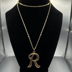 Avon initial letter “R” gold tone pendant necklace. Never worn.